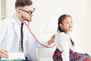 Urgent care doctor providing pediatric care to young girl